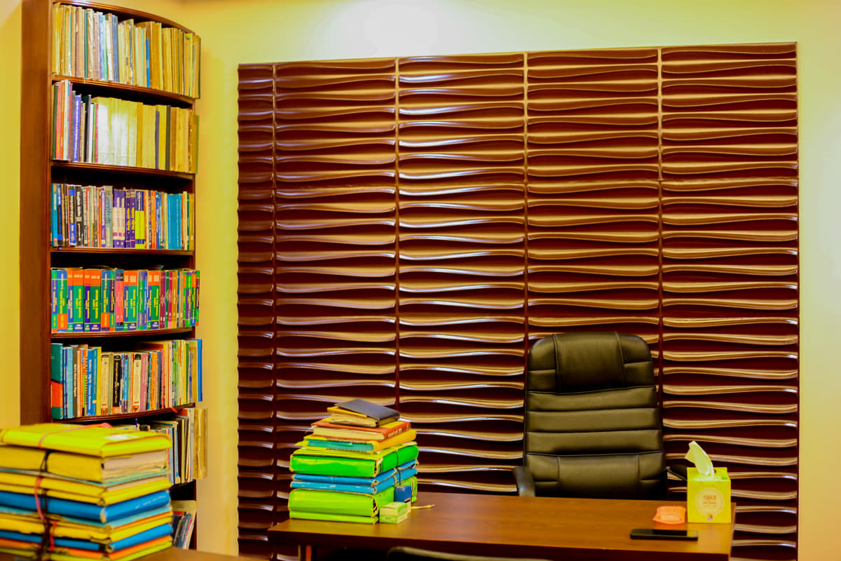 The consulting room desk, with bundles of case files tied and stacked beside it.